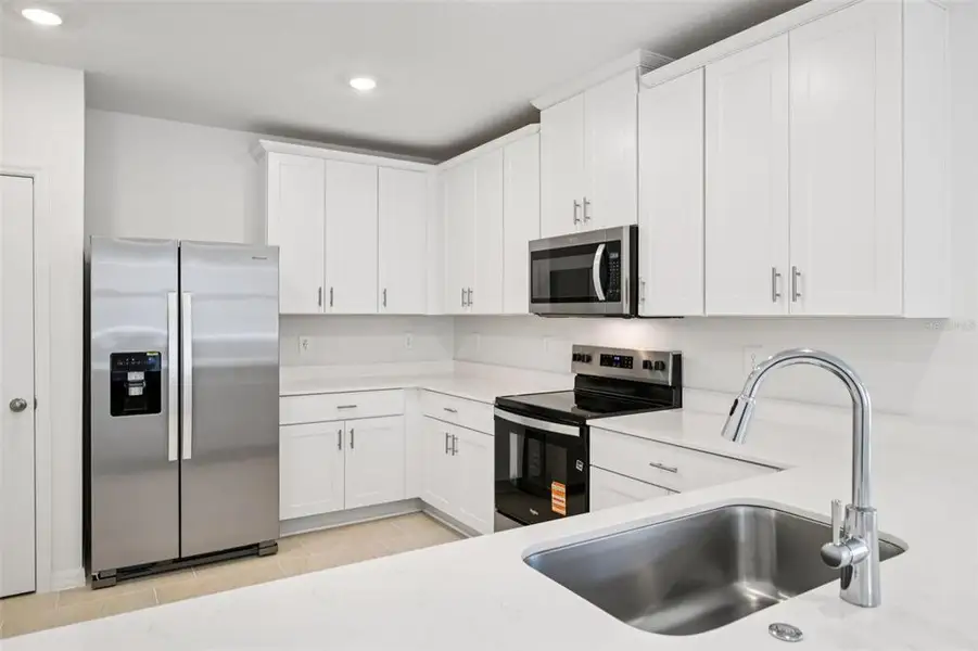 Furnished interior view inside a new home in Ridgehaven - Villas, Ormond Beach (Image 7).