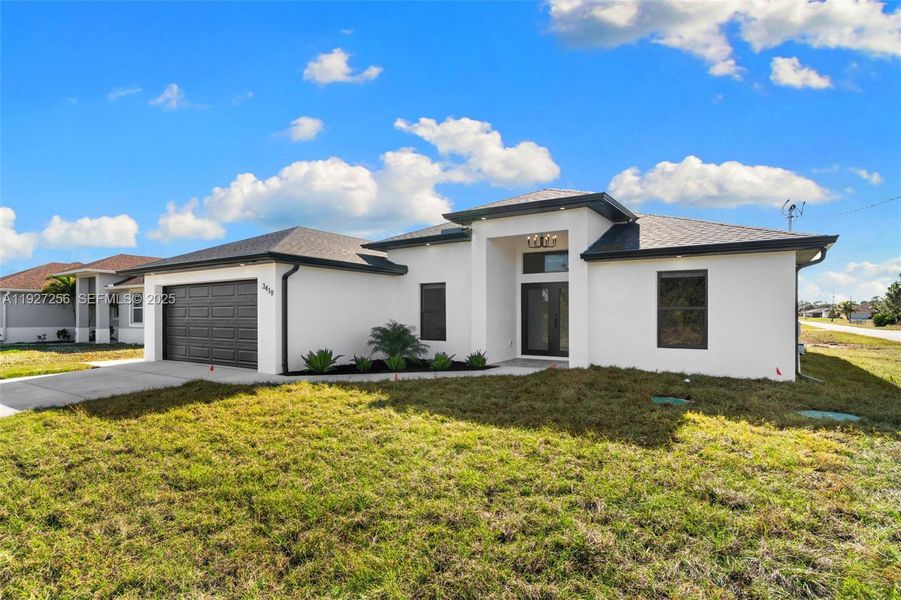 Front exterior of a new home in , Lehigh Acres, FL, highlighting curb appeal (Image 2).