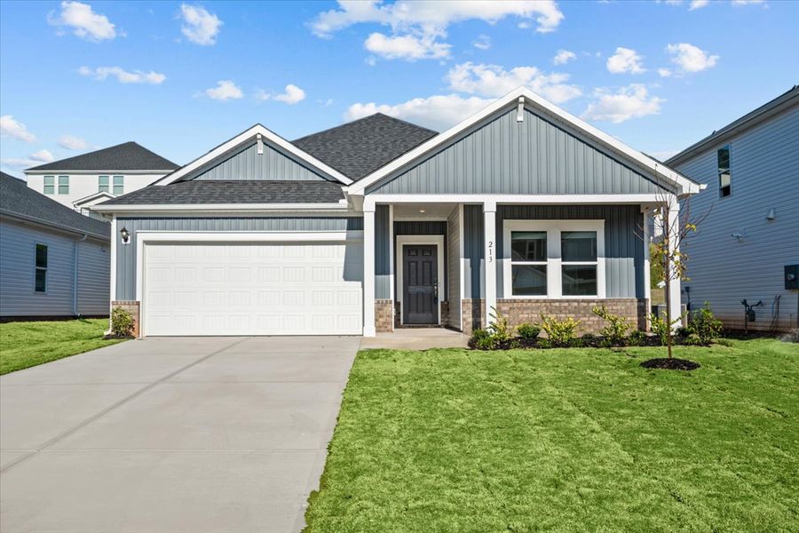 Front exterior of a new home in The Farm at Wells Creek - Signature Collection, Gray Court, SC, highlighting curb appeal (Image 1).