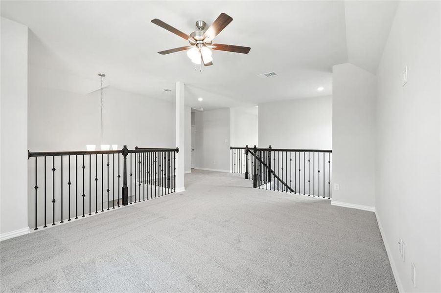 Spare room with carpet flooring, a ceiling fan, recessed lighting, and vaulted ceiling Spare room with carpet flooring, a ceiling fan, recessed lighting, and vaulted ceiling