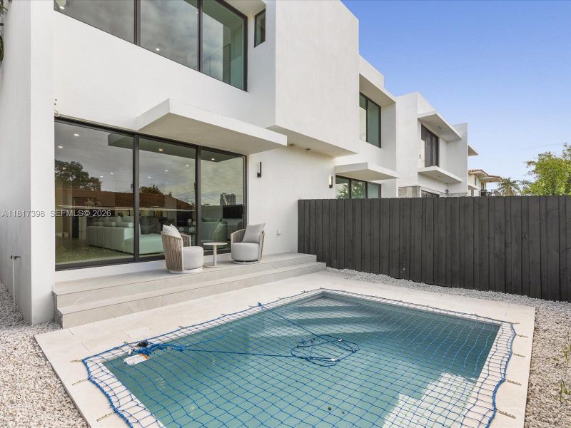 Exterior details and patio area of a home in , Miami (Image 3).