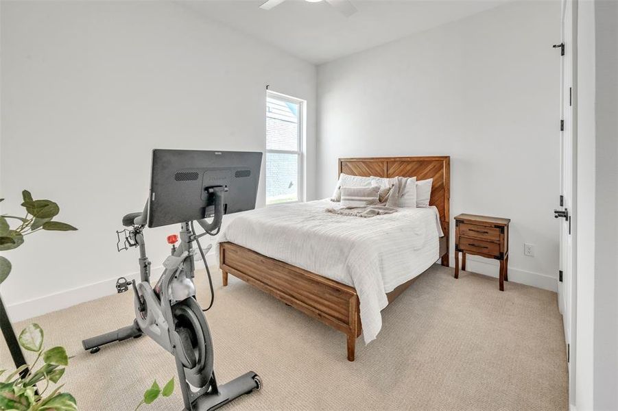 Additional Bedroom featuring ceiling fan and light colored carpet