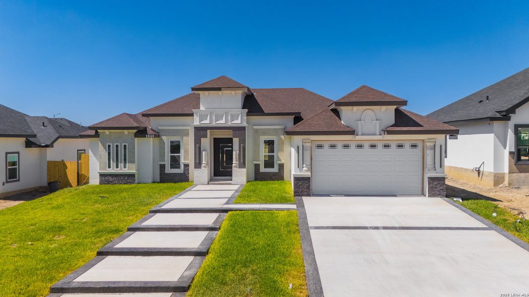 Front exterior of a new home in , Eagle Pass, TX, highlighting curb appeal (Image 24). Front exterior of a new home in , Eagle Pass, TX, highlighting curb appeal (Image 24).