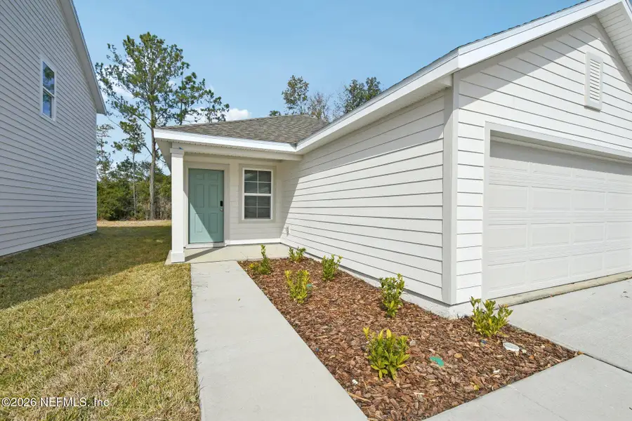 Exterior details and patio area of a home in Kings Landing, Jacksonville (Image 10).