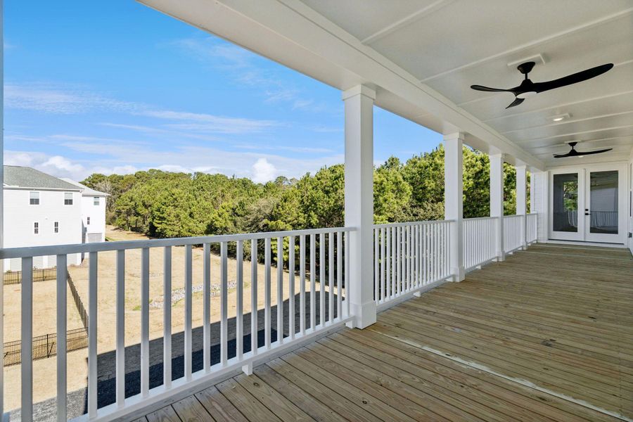 Exterior details and patio area of a home in Overlook at Copahee Sound, Awendaw (Image 32).