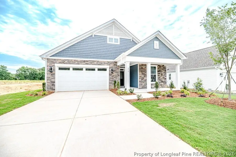 Front exterior of a new home in The Cottages at 78 North, Sanford, NC, highlighting curb appeal (Image 2). Front exterior of a new home in The Cottages at 78 North, Sanford, NC, highlighting curb appeal (Image 2).