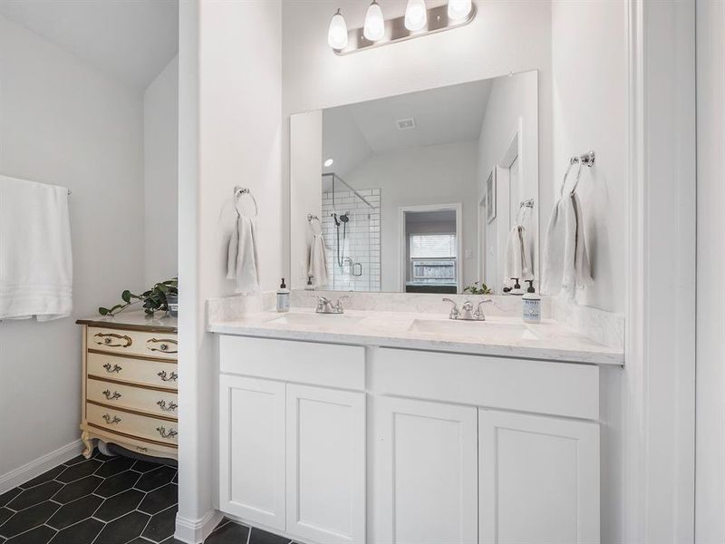 Double sinks, a large closet and extra room for storage!