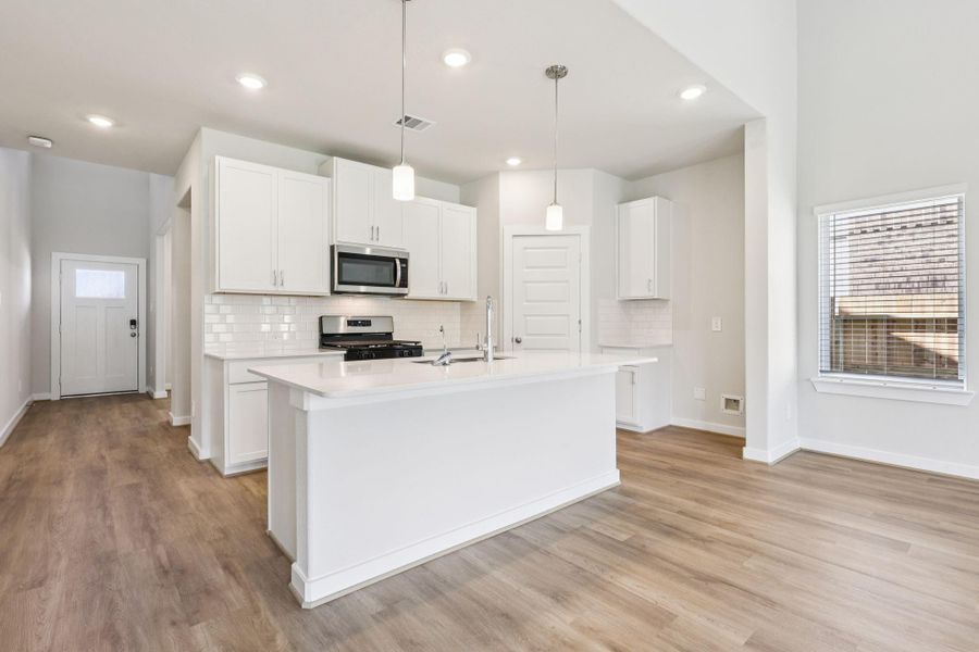 Furnished interior view inside a new home in Pine Lake Cove - Classic Series, Montgomery (Image 10).
