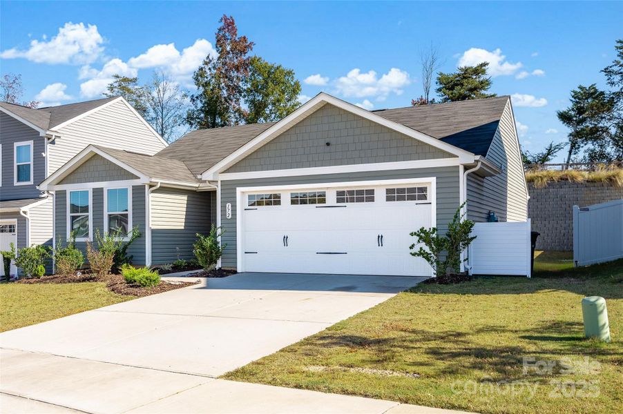 Front exterior of a new home in , Troutman, NC, highlighting curb appeal (Image 18).