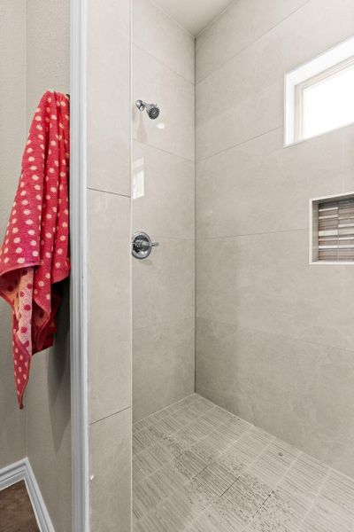 Full bath with tiled shower