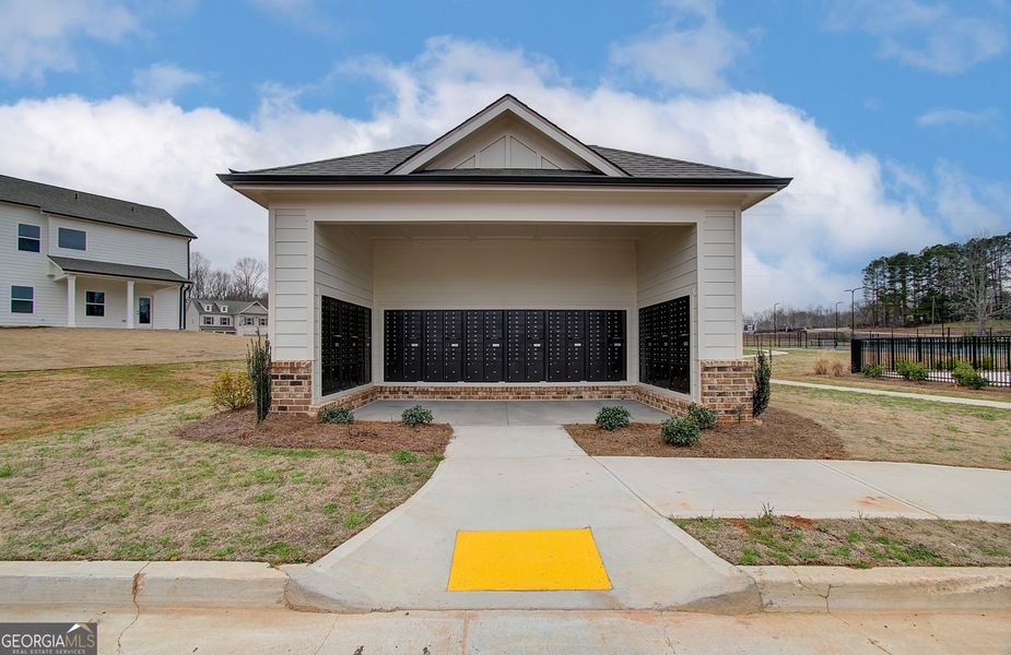 Front exterior of a new home in Ponderosa Farms Manor, Gainesville, GA, highlighting curb appeal (Image 26).