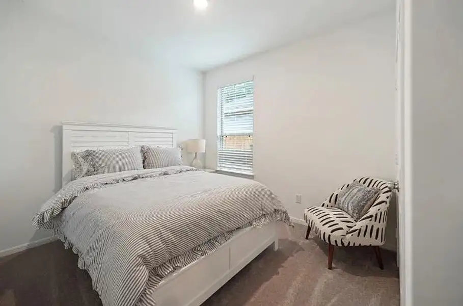 Furnished interior view inside a new home in The Pines At Seven Coves, Conroe (Image 8).