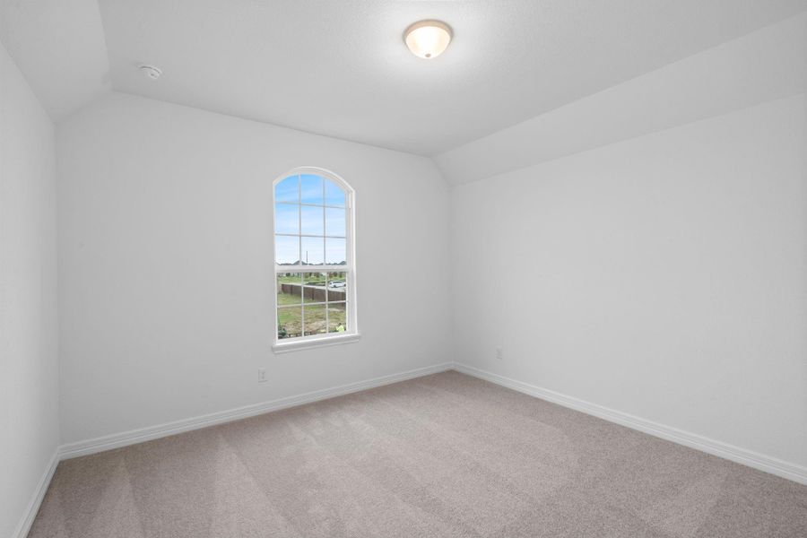 Your secondary bedroom features plush carpet, fresh paint, closet, and a large window that lets in plenty of natural lighting.