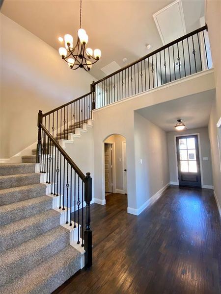 Impressive entry with cathedreal ceiling, ORB chandelier, and wrought iron spindles on the staircase Impressive entry with cathedreal ceiling, ORB chandelier, and wrought iron spindles on the staircase