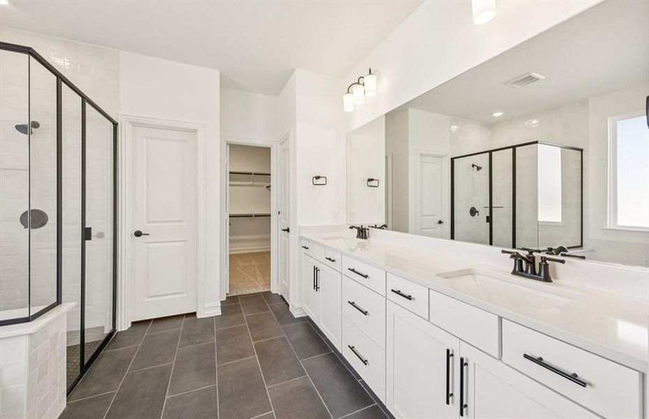 Spacious owner's bath with ample cabinet storage Spacious owner's bath with ample cabinet storage