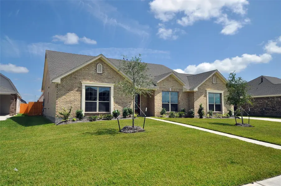 Front exterior of a new home in , League City, TX, highlighting curb appeal (Image 2). Front exterior of a new home in , League City, TX, highlighting curb appeal (Image 2).