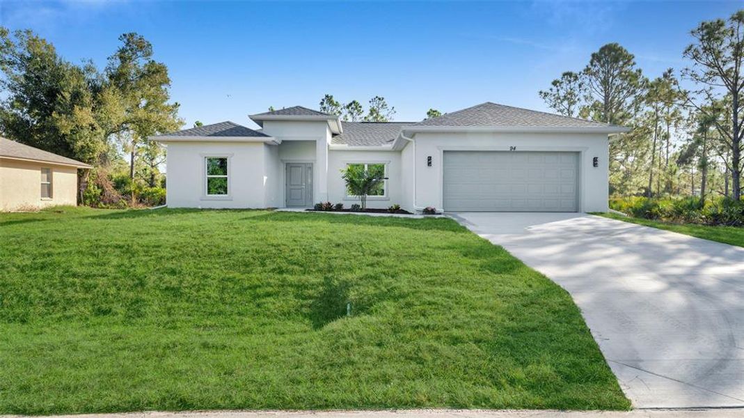 Front exterior of a new home in , Port Charlotte, FL, highlighting curb appeal (Image 1). Front exterior of a new home in , Port Charlotte, FL, highlighting curb appeal (Image 1).