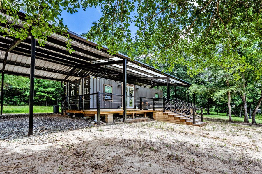 Exterior details and patio area of a home in , New Waverly (Image 22). Exterior details and patio area of a home in , New Waverly (Image 22).
