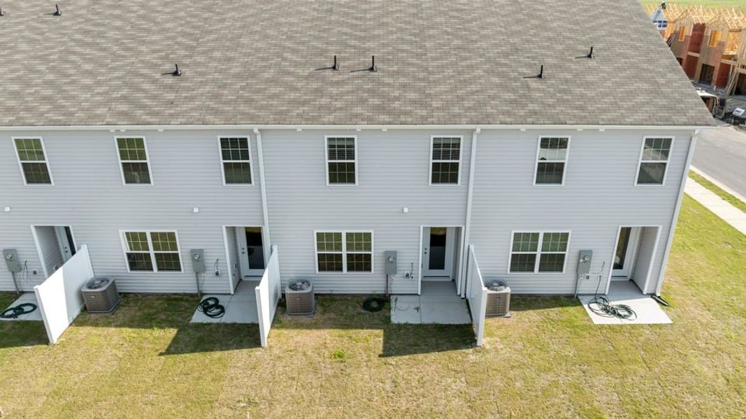 Exterior details and patio area of a home in The Townes at Ridgewood Farms, Winterville (Image 23).