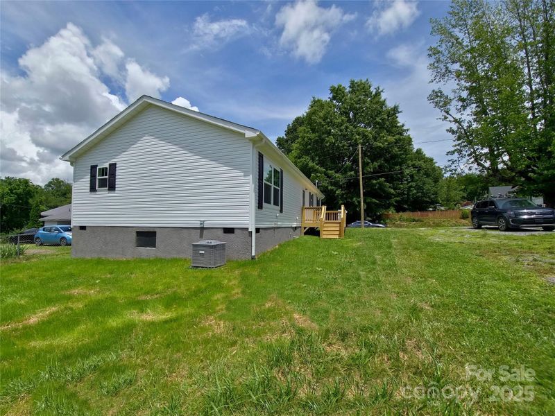 Front exterior of a new home in , Swannanoa, NC, highlighting curb appeal (Image 1).