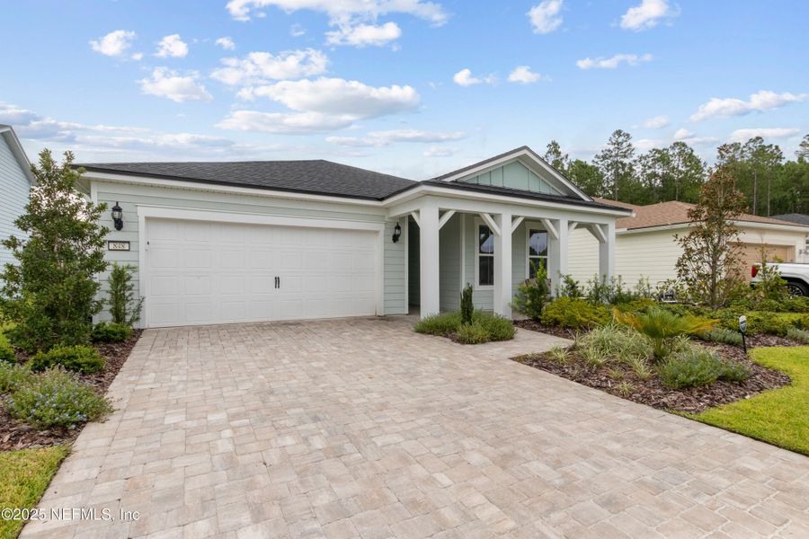 Front exterior of a new home in , Yulee, FL, highlighting curb appeal (Image 21). Front exterior of a new home in , Yulee, FL, highlighting curb appeal (Image 21).