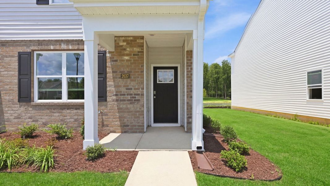 Exterior details and patio area of a home in Clock Road Townhomes, New Bern (Image 2). Exterior details and patio area of a home in Clock Road Townhomes, New Bern (Image 2).