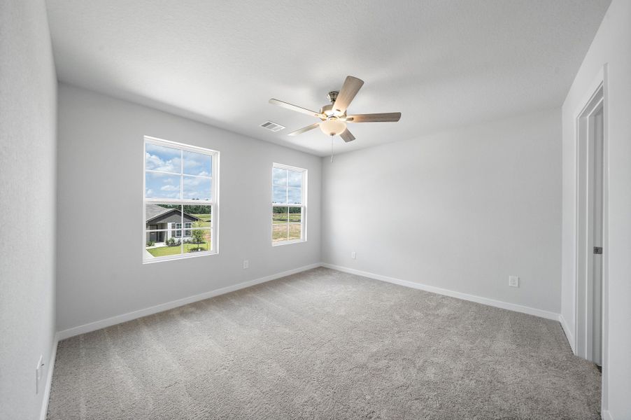 A room with a ceiling fan and a window. A room with a ceiling fan and a window.