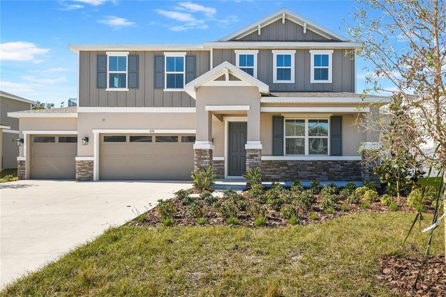 Front exterior of a new home in Seasons at Wekiva Ridge, Mount Dora, FL, highlighting curb appeal (Image 1). Front exterior of a new home in Seasons at Wekiva Ridge, Mount Dora, FL, highlighting curb appeal (Image 1).