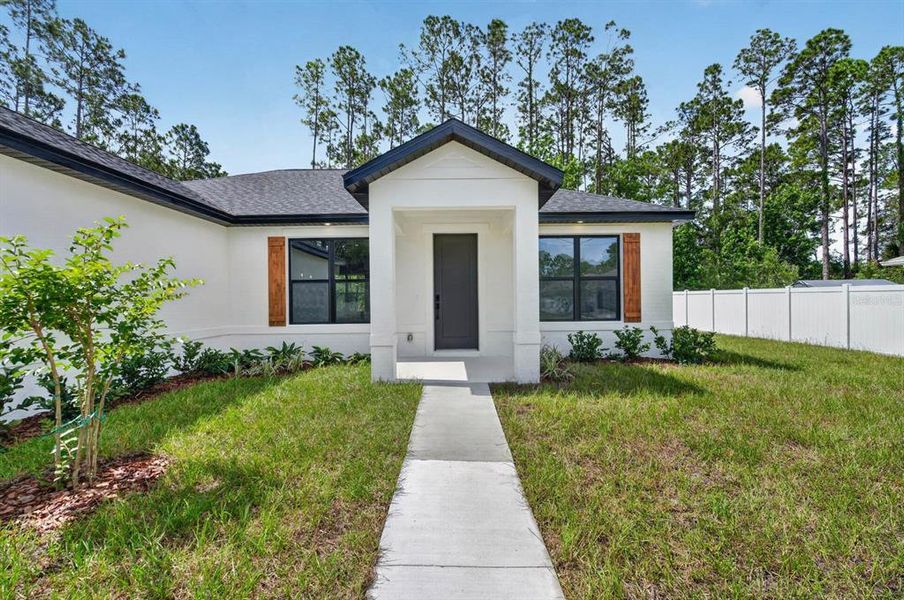Front exterior of a new home in , Palm Coast, FL, highlighting curb appeal (Image 25). Front exterior of a new home in , Palm Coast, FL, highlighting curb appeal (Image 25).
