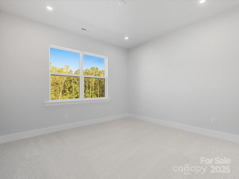 Bedroom 3 with Tree-Lined Views.