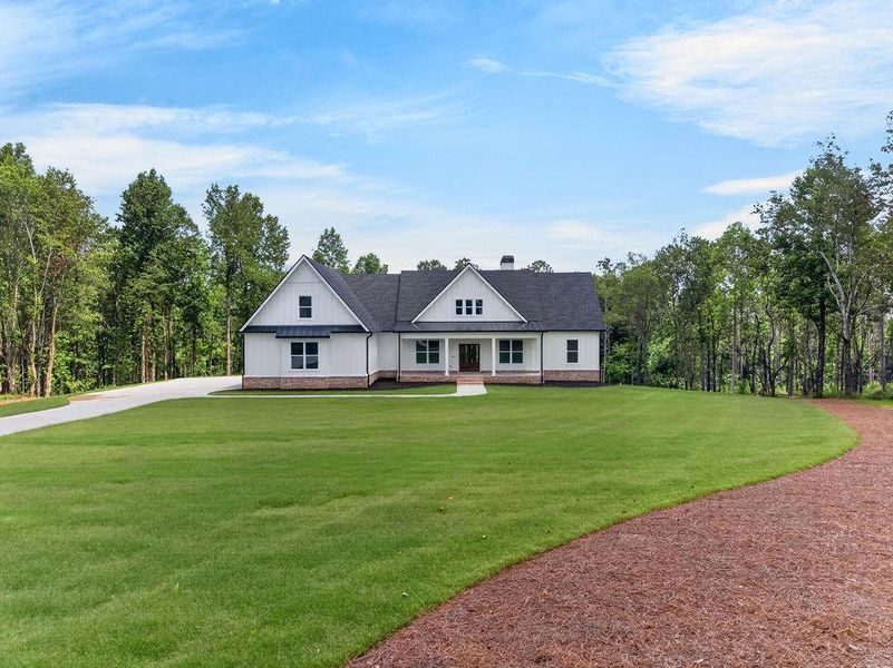 Front exterior of a new home in , Fairmount, GA, highlighting curb appeal (Image 29). Front exterior of a new home in , Fairmount, GA, highlighting curb appeal (Image 29).