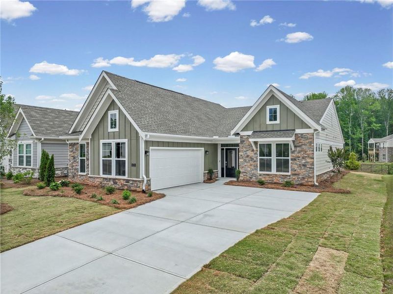 Front exterior of a new home in Laurel Farms, Dallas, GA, highlighting curb appeal (Image 23). Front exterior of a new home in Laurel Farms, Dallas, GA, highlighting curb appeal (Image 23).