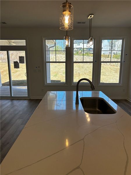 This spacious kitchen with a large island and ampl