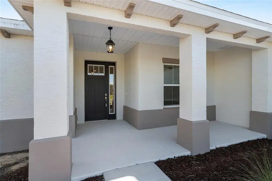 Exterior details and patio area of a home in , Ocala (Image 3).