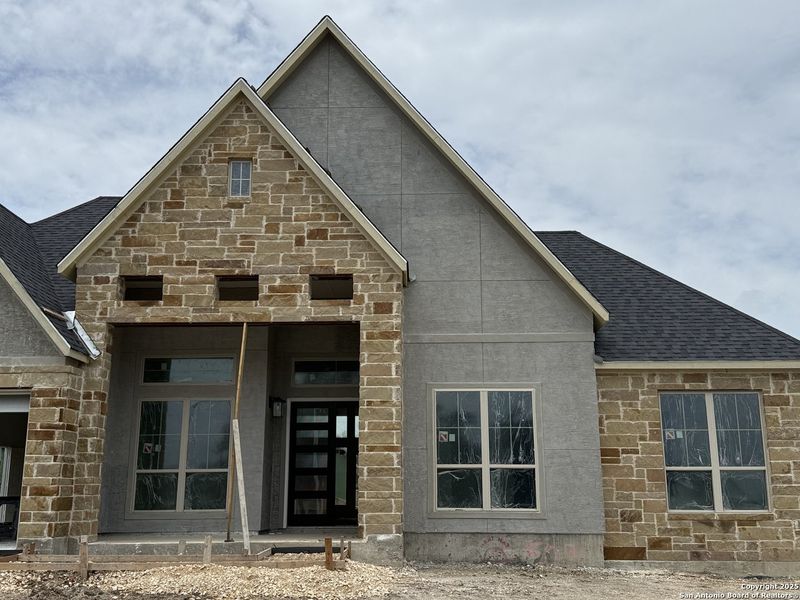 Front exterior of a new home in Mesa Western, Cibolo, TX, highlighting curb appeal (Image 22). Front exterior of a new home in Mesa Western, Cibolo, TX, highlighting curb appeal (Image 22).