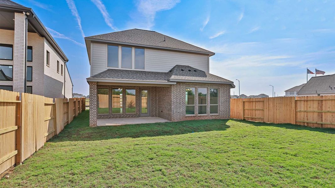 Exterior details and patio area of a home in Lakes of Cane Island, Katy (Image 2).