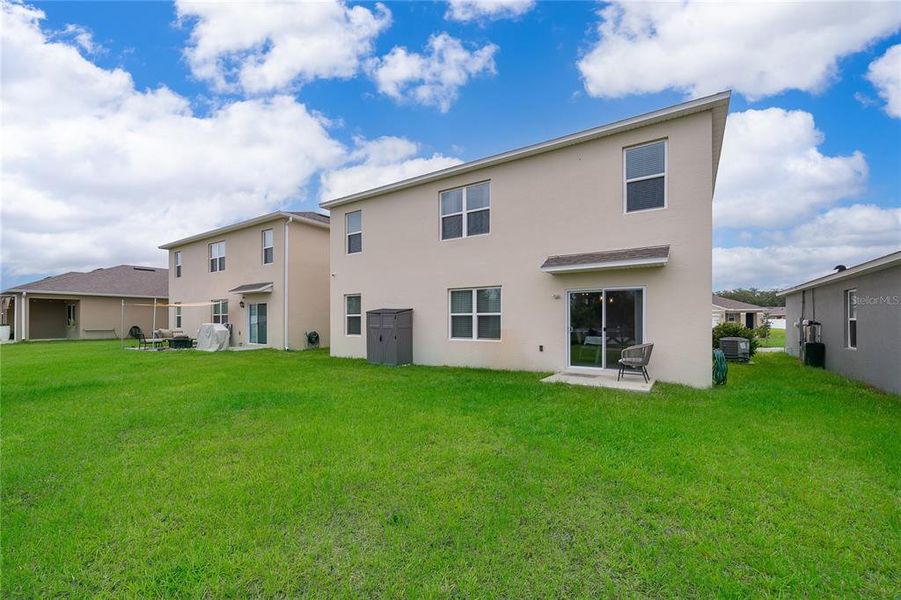 Exterior details and patio area of a home in Kindred, Kissimmee (Image 4).
