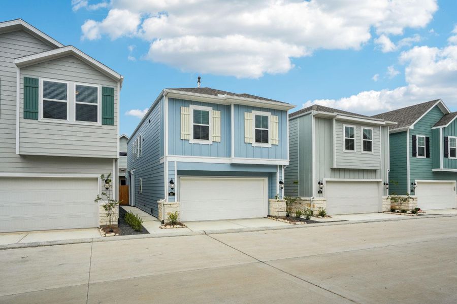 Front exterior of a new home in Kemah Crossing - City Series, Kemah, TX, highlighting curb appeal (Image 28). Front exterior of a new home in Kemah Crossing - City Series, Kemah, TX, highlighting curb appeal (Image 28).