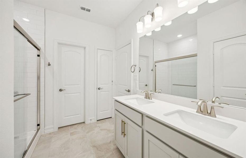 Owner's private bath with double vanity