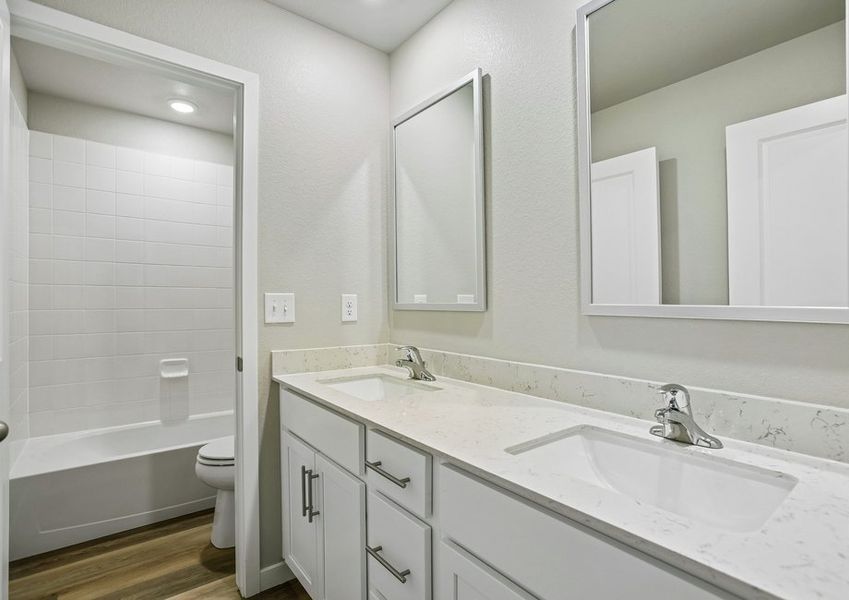The secondary bathroom has a tub/shower combo.
