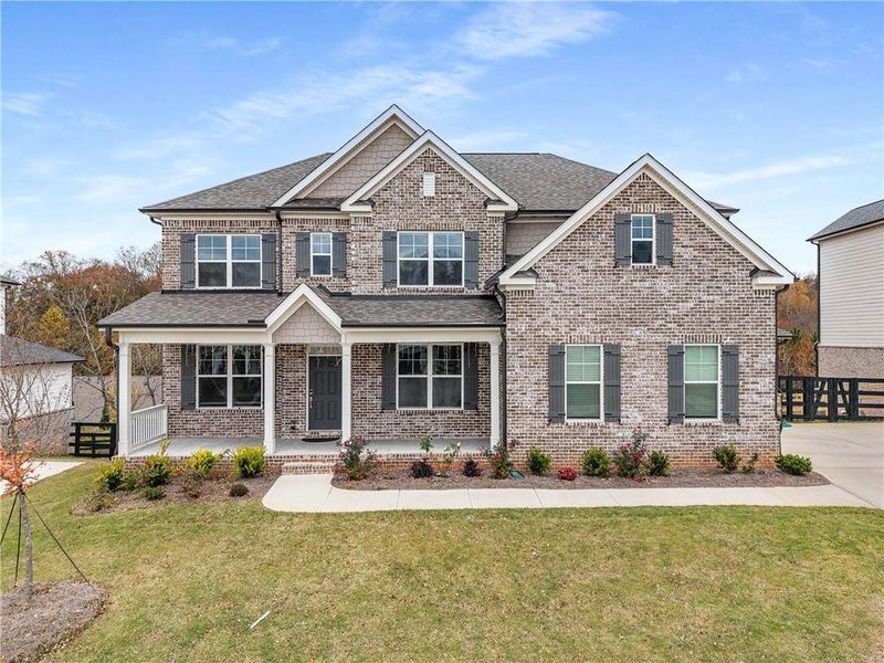 Front exterior of a new home in Carmichael Farms, Canton, GA, highlighting curb appeal (Image 2).