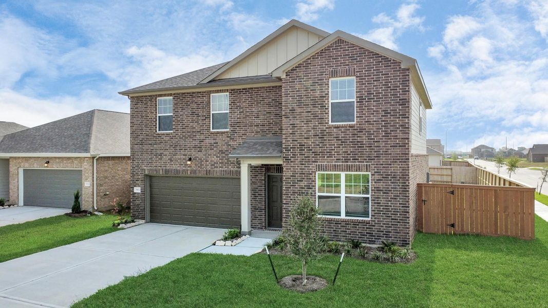 Front exterior of a new home in Sunterra, Katy, TX, highlighting curb appeal (Image 23).
