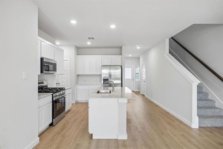 Kitchen in the Mesquite home plan by Trophy Signature Homes – REPRESENTATIVE PHOTO Kitchen in the Mesquite home plan by Trophy Signature Homes – REPRESENTATIVE PHOTO