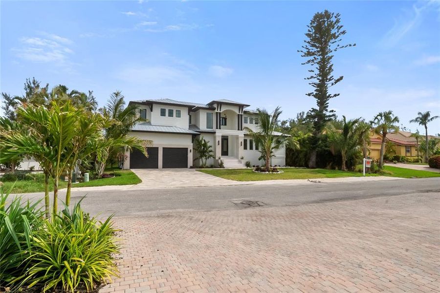 Front exterior of a new home in , Longboat Key, FL, highlighting curb appeal (Image 35). Front exterior of a new home in , Longboat Key, FL, highlighting curb appeal (Image 35).