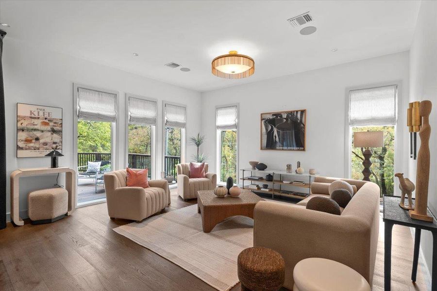 The living room is flooded with natural light.