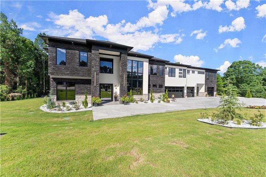 Front exterior of a new home in , Lawrenceville, GA, highlighting curb appeal (Image 24).