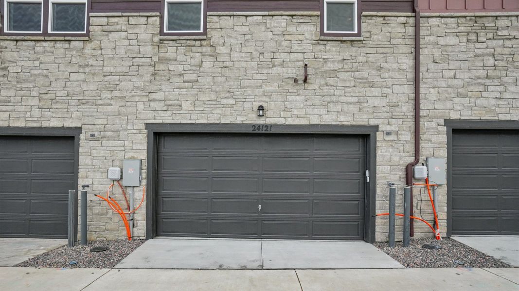 Rear exterior of the quick move-in home with attached two-car garage. Rear exterior of the quick move-in home with attached two-car garage.