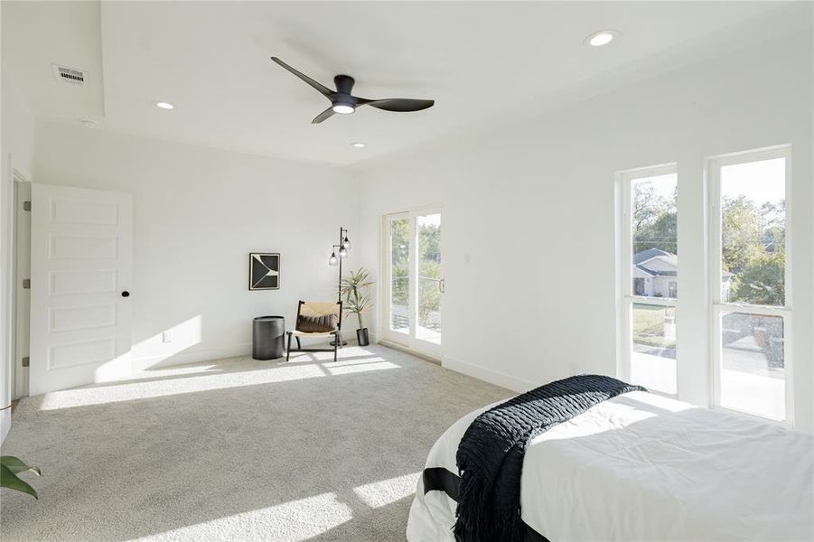 Carpeted bedroom featuring recessed lighting, access to private Patio and ceiling fan Carpeted bedroom featuring recessed lighting, access to private Patio and ceiling fan