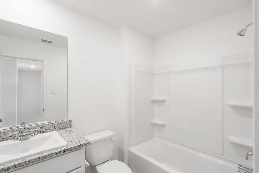 Furnished interior view inside a new home in Cypress Trails at Bauer Landing, Hockley (Image 4).