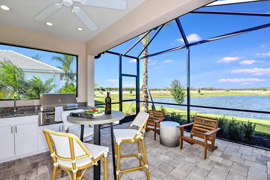 Exterior details and patio area of a home in SkySail, Naples (Image 3).